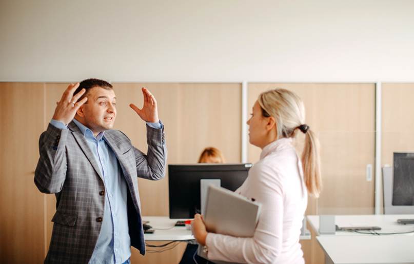 Man arguing with female coworker - Whistleblower Protection